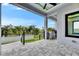 The outdoor kitchen on the patio offers a relaxing space with views of the garden at 6526 Simone Shores Cir, Apollo Beach, FL 33572