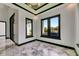 Bright sitting area with large windows that offer views of the pool and tropical landscaping at 6526 Simone Shores Cir, Apollo Beach, FL 33572