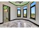 Bay window room with black trim and sleek flooring offers plentiful views and light at 6526 Simone Shores Cir, Apollo Beach, FL 33572