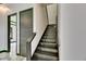 Modern stairway with sleek railings and elegant lighting, creating a contemporary aesthetic at 6526 Simone Shores Cir, Apollo Beach, FL 33572