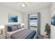 Well-lit bedroom with a comfortable bed, large window, and stylish decor for relaxation and rest at 6604 2Nd Ne Ave, Bradenton, FL 34208