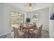 Dining room area with a view of the screened patio, perfect for Gathering meals and gatherings at 6604 2Nd Ne Ave, Bradenton, FL 34208