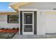 Enclosed front porch leads to the main entrance, providing a shaded entry with great curb appeal at 6604 2Nd Ne Ave, Bradenton, FL 34208