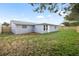 Spacious backyard with lush green grass, ideal for outdoor activities, surrounded by a newly installed wooden fence at 6804 Tierra Verde St, Port Richey, FL 34668