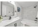 Modern bathroom featuring a sleek vanity, a bathtub, and stylish fixtures at 6804 Tierra Verde St, Port Richey, FL 34668