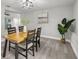 Bright dining room featuring a wooden table with stylish seating and minimalist decor at 6804 Tierra Verde St, Port Richey, FL 34668