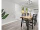 Well-lit dining room with a wooden table, modern chairs, and stylish decor at 6804 Tierra Verde St, Port Richey, FL 34668