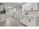 Contemporary kitchen featuring white cabinets, stainless steel appliances, and ample counter space at 6804 Tierra Verde St, Port Richey, FL 34668