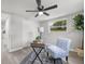 Bright office with a ceiling fan, a desk, and a view of the outdoors at 6804 Tierra Verde St, Port Richey, FL 34668