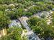 An aerial view displays single Gathering homes with private backyards and mature trees at 6918 Potomac Cir, Riverview, FL 33578