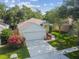 Aerial view of a charming single-story home, featuring a two-car garage and well-maintained lawn at 6918 Potomac Cir, Riverview, FL 33578