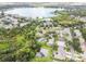 Aerial view of homes in a neighborhood, lake and community pool at 6918 Potomac Cir, Riverview, FL 33578