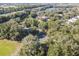 An aerial view of a park featuring a lake, sports fields, and natural surroundings at 6918 Potomac Cir, Riverview, FL 33578
