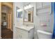 Bright bathroom featuring white cabinets and counters, and a modern faucet at 6918 Potomac Cir, Riverview, FL 33578