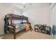 Bedroom featuring bunk beds, carpet, and a ceiling fan at 6918 Potomac Cir, Riverview, FL 33578