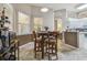 Breakfast nook adjacent to kitchen with lots of sunlight and 4 chairs at 6918 Potomac Cir, Riverview, FL 33578