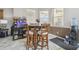Breakfast nook with high top table, four chairs, and natural light at 6918 Potomac Cir, Riverview, FL 33578
