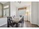 Bright dining room with modern lighting, wood floors, and neutral walls at 6918 Potomac Cir, Riverview, FL 33578