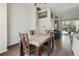 Dining room featuring a granite dining table, wood floors, and bright open space at 6918 Potomac Cir, Riverview, FL 33578
