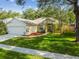 Charming single-story home featuring an attached two-car garage and beautiful front lawn at 6918 Potomac Cir, Riverview, FL 33578