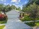 Attractive single-story home with a two-car garage, well-maintained lawn, and lush landscaping at 6918 Potomac Cir, Riverview, FL 33578