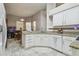 Bright kitchen featuring granite countertops, tiled floors, and plenty of cabinet space at 6918 Potomac Cir, Riverview, FL 33578