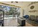 View of the tiled lanai with seating and view of pool at 6918 Potomac Cir, Riverview, FL 33578