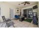 View of the tiled lanai with ceiling fan and decor at 6918 Potomac Cir, Riverview, FL 33578