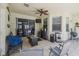 View of the lanai, tiled floor, with ceiling fan and tv at 6918 Potomac Cir, Riverview, FL 33578
