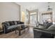 Bright living room featuring views of the entryway and dining space, with natural light and wood flooring at 6918 Potomac Cir, Riverview, FL 33578