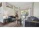 Spacious living area with high ceilings, with an archway leading into the dining area and pool views at 6918 Potomac Cir, Riverview, FL 33578