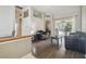 Bright living area with views to the pool, featuring hardwood flooring and neutral wall colors at 6918 Potomac Cir, Riverview, FL 33578