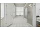 Bright bathroom features a tub, shower and window at 6918 Potomac Cir, Riverview, FL 33578