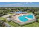 Community clubhouse and pool with wading area and lap lanes, nestled within a well-maintained, tree-lined neighborhood at 6918 Potomac Cir, Riverview, FL 33578