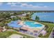 Overhead shot of the community's clubhouse and pool area by the lake, perfect for summer fun and neighborhood gatherings at 6918 Potomac Cir, Riverview, FL 33578