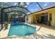 Enclosed pool features a screened-in lanai with patio seating and access to the home's interior at 6918 Potomac Cir, Riverview, FL 33578