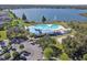 Lakeside community pool and clubhouse; enjoy leisure and recreation surrounded by greenery, palm trees, and picturesque views at 6918 Potomac Cir, Riverview, FL 33578