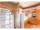 Luxurious bathroom with walk-in glass block shower, separate tub, and wooden cabinets at 6928 Cozumel Ct, Land O Lakes, FL 34637