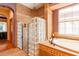 An elegant main bath featuring a glass block walk-in shower and a relaxing soaking tub with jet action at 6928 Cozumel Ct, Land O Lakes, FL 34637