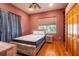Bedroom features a bed, window, and closet at 6928 Cozumel Ct, Land O Lakes, FL 34637