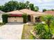 Charming one-story home featuring a tile roof, stone accents, and a landscaped front yard at 6928 Cozumel Ct, Land O Lakes, FL 34637