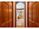 Hallway view leading into bathroom, featuring wooden cabinets at 6928 Cozumel Ct, Land O Lakes, FL 34637