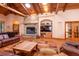 Living room features fireplace, media center, wood floors, skylights and beamed ceilings at 6928 Cozumel Ct, Land O Lakes, FL 34637