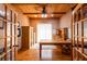 Office space featuring wood floors, wood ceiling with beams, and french door entry at 6928 Cozumel Ct, Land O Lakes, FL 34637