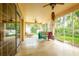 Large screened-in patio with ceiling fans and ample room for lounging or entertaining at 6928 Cozumel Ct, Land O Lakes, FL 34637