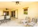 Covered outdoor lanai features ceiling fans, tile floor, and seating at 6928 Cozumel Ct, Land O Lakes, FL 34637