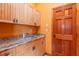 Utility room featuring a sink and cabinets at 6928 Cozumel Ct, Land O Lakes, FL 34637