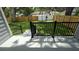 Fenced backyard with black metal handrails leading down to a large green lawn at 7011 N 15Th St, Tampa, FL 33610