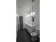 Modern bathroom with white cabinets, a vessel sink, and glass enclosed shower at 7011 N 15Th St, Tampa, FL 33610