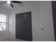 Cozy bedroom featuring double doors and ample natural light from the window at 7011 N 15Th St, Tampa, FL 33610